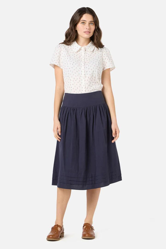 Image of a model wearing Skirts. Productname: Lexi Gathered Yoke Skirt in Navy colour by brand - Princess Highway