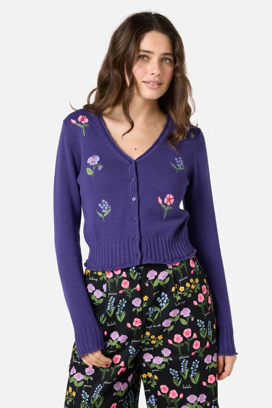 Image of a model wearing Outerwear. Productname: Flower Patch Emb Cardigan in Purple colour by brand - Princess Highway