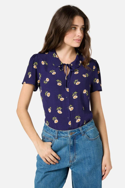 Image of a model wearing Tops. Productname: Marguerite Daisy Blouse in Navy colour by brand - Princess Highway