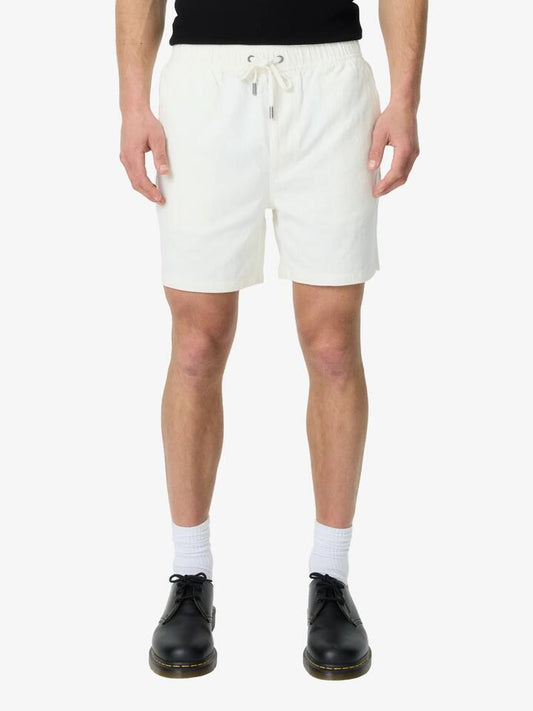 Image of a model wearing Shorts. Productname: Article One Luigi Linen Short in Off White colour by brand - Article One