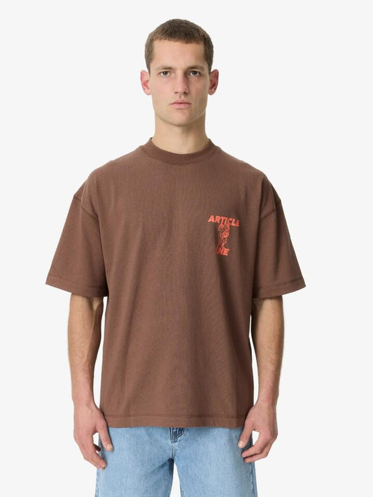 Image of a model wearing Tops. Productname: Article One Champs Tee in Brown colour by brand - Article One