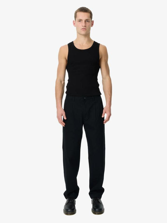 Image of a model wearing Pants. Productname: Article One Bolton Chino in Black colour by brand - Article One