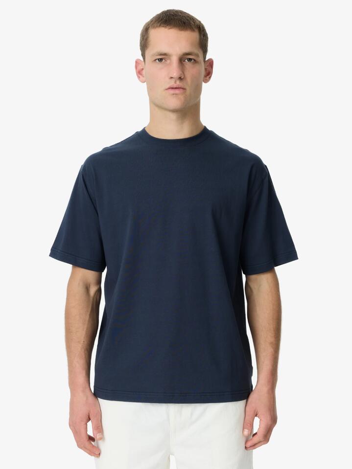 Image of a model wearing Tops. Productname: Article One Premium Relaxed Tee in Navy colour by brand - Article One