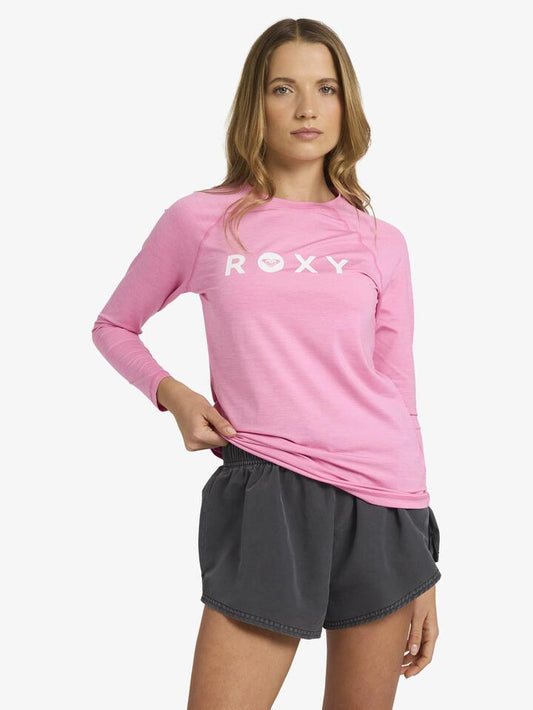 Image of a model wearing Tops. Productname: Roxy Womens Essentials Lycra Long Sleeve Rash Vest Pink Cosmos - in Pink Cosmos colour by brand - Roxy