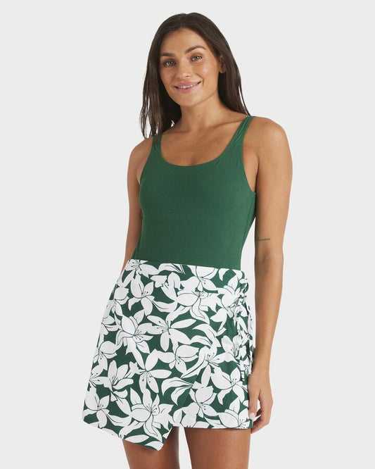 Image of a model wearing Skirts. Productname: Roxy - Womens Khloe Wrap Mini Skirt - Evergreen - in Evergreen colour by brand - Roxy