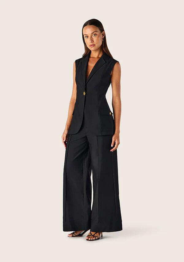 Image of a model wearing Tops. Productname: Carmelita Vest in Black colour by brand - MOS The Label