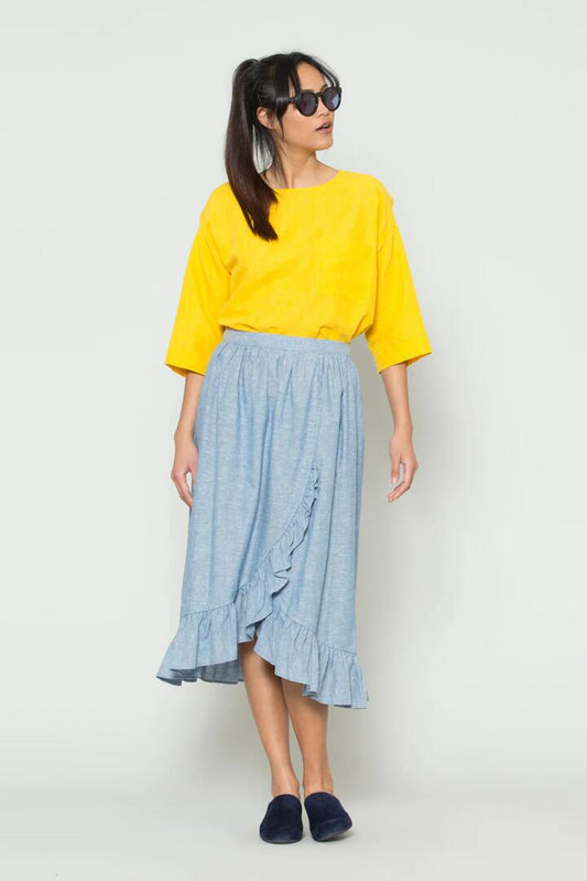 Image of a model wearing Skirts. Productname: Chambray Frill WrapSkirt in Blue colour by brand - Gorman
