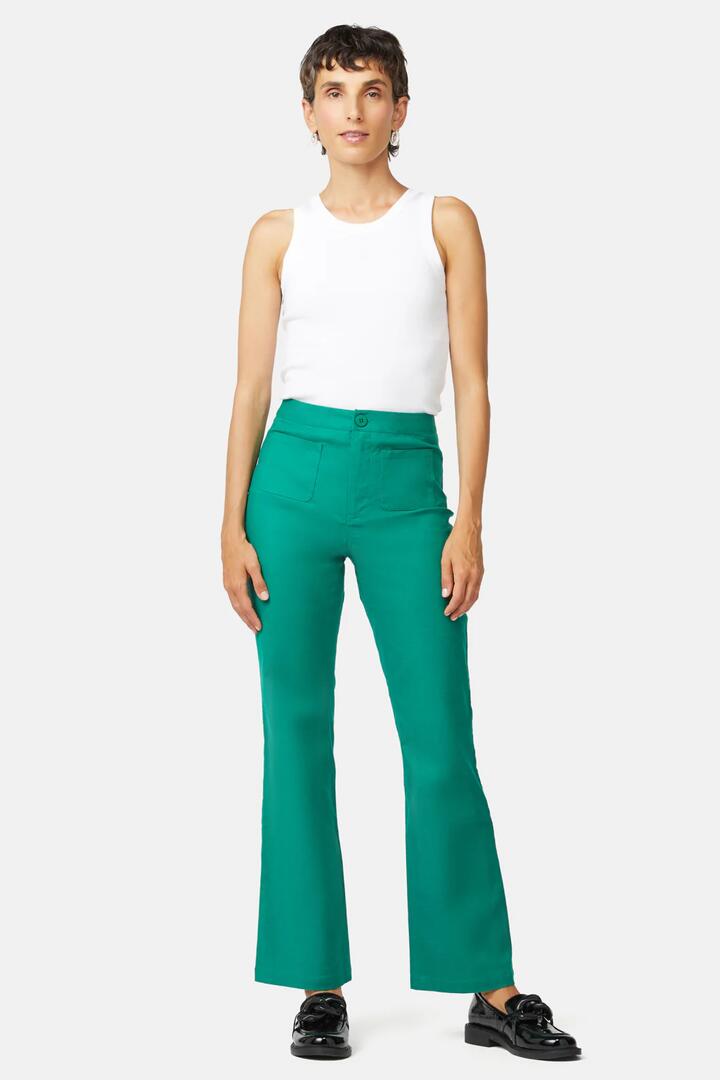 Image of a model wearing Pants. Product name - Jackie Flare Pant in Black colour by brand - Gorman