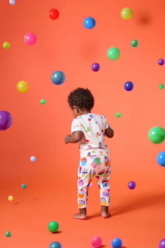 Image of a model wearing Pants. Product name - Cupcakes Baby Legging in Cream colour by brand - Gorman