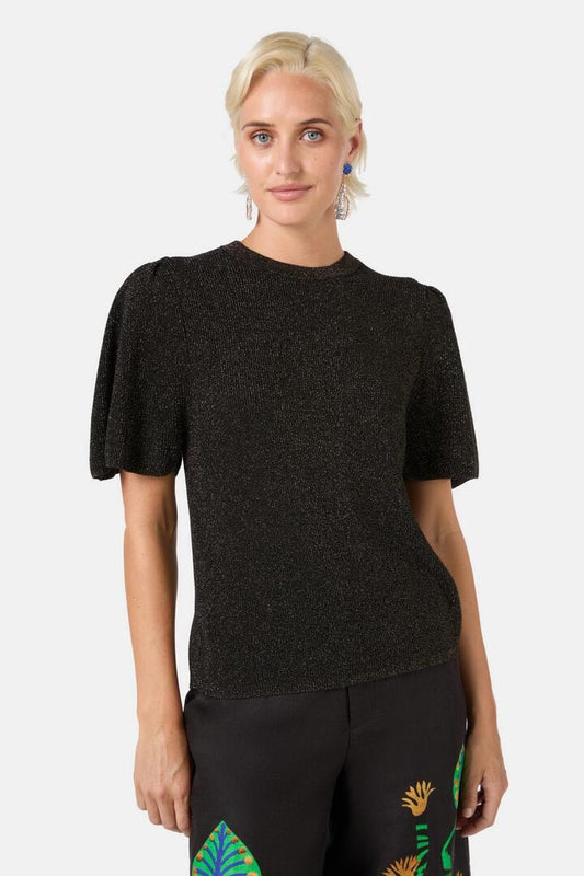 Image of a model wearing Tops. Productname: Lotus Knit Top in Black colour by brand - Gorman