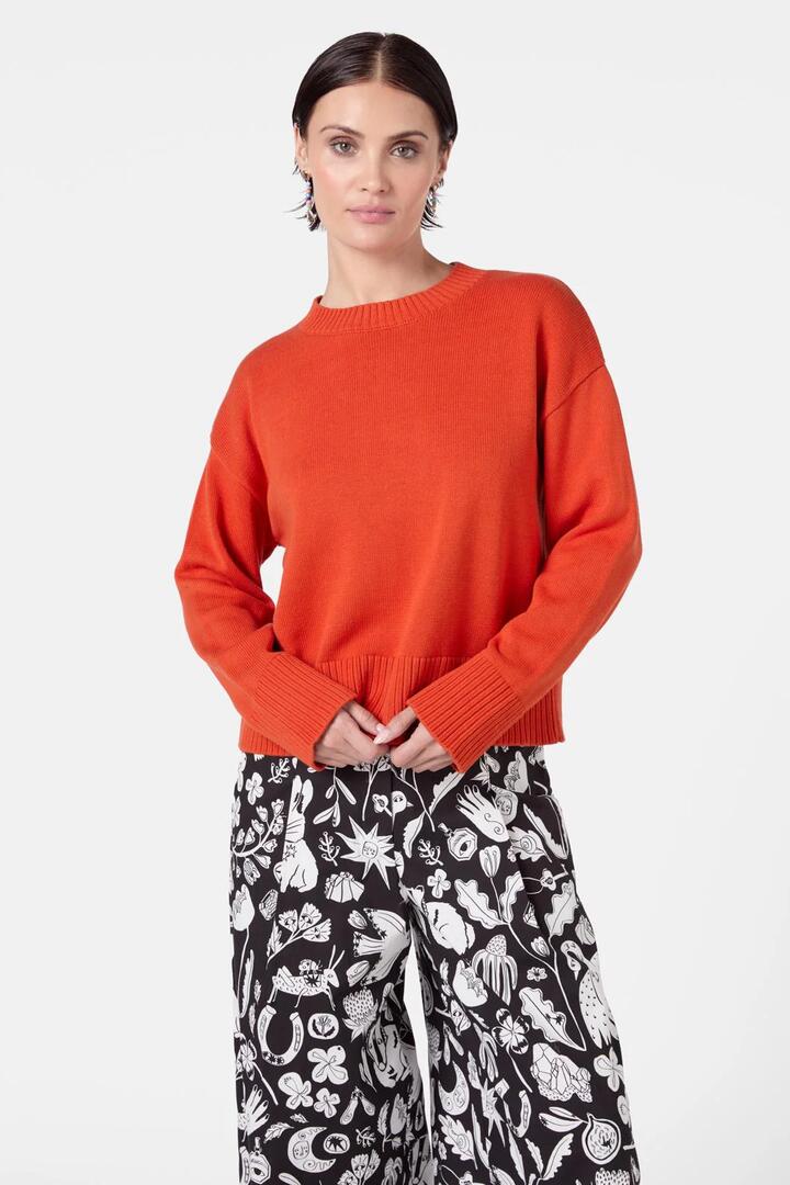 Image of a model wearing Outerwear. Product name - Hazel Jumper in Rust colour by brand - Gorman