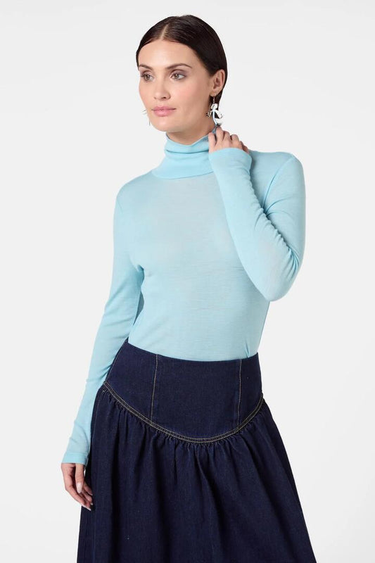 Image of a model wearing Tops. Productname: Merino Polo Top in Plum colour by brand - Gorman