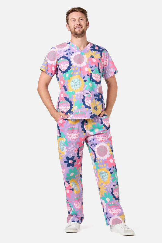 Image of a model wearing Uniforms & Workwear. Product name - Daisy Sketch Scrub Set in Multi colour by brand - Gorman