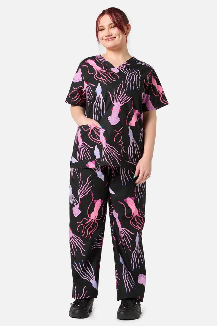Image of a model wearing Uniforms & Workwear. Product name - Giant Squid Scrub Set in Black colour by brand - Gorman