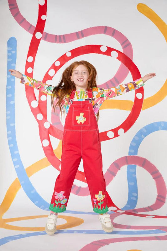 Image of a model wearing Pants. Productname: Red Floral Kids Overalls in Red colour by brand - Gorman