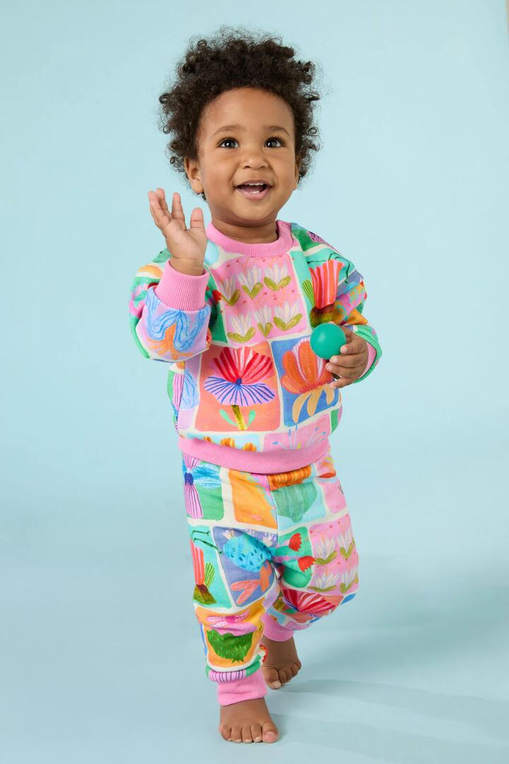 Image of a model wearing Pants. Product name - Wild Blooms Baby Jogger in Multi colour by brand - Gorman