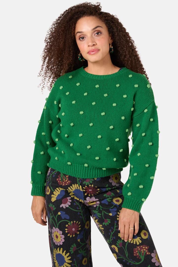 Image of a model wearing Outerwear. Product name - Pom Pom Jumper in Green colour by brand - Gorman
