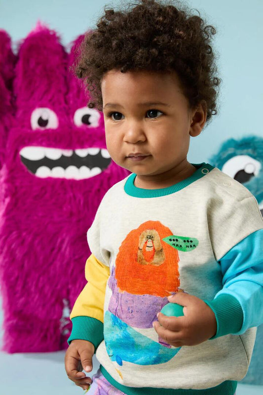 Image of a model wearing Outerwear. Productname: Animals Stack Baby Sweater in Multi colour by brand - Gorman