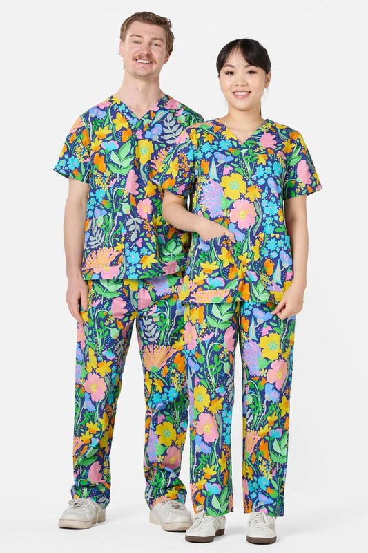 Image of a model wearing Uniforms & Workwear. Product name - Flora Scrub Set in Multi colour by brand - Gorman