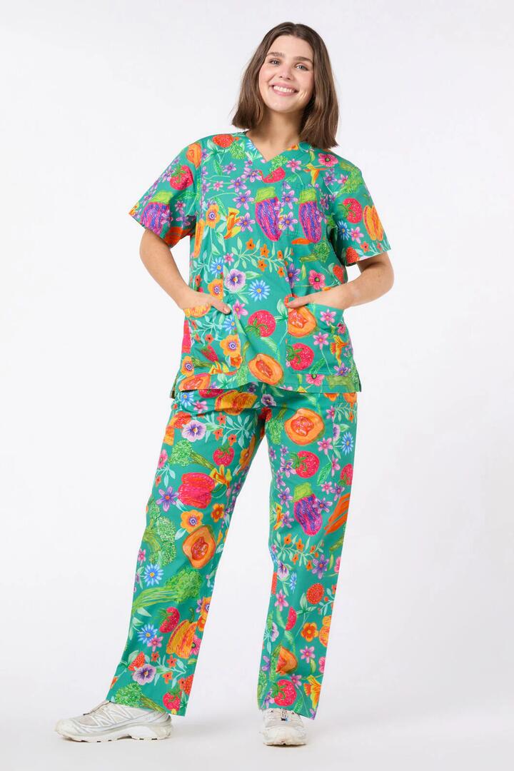 Image of a model wearing Uniforms & Workwear. Product name - Seasonal Scrub Set in Green colour by brand - Gorman