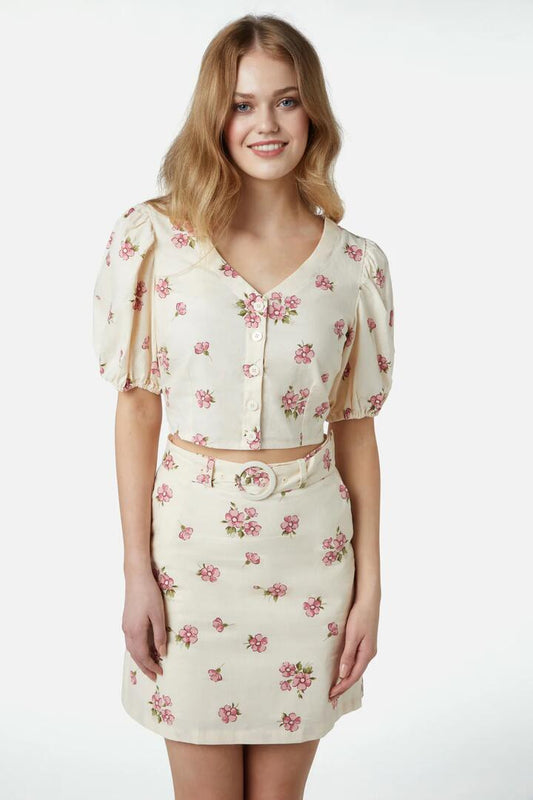 Image of a model wearing Skirts. Productname: Bianca Ditsy Skirt in Cream colour by brand - Princess Highway