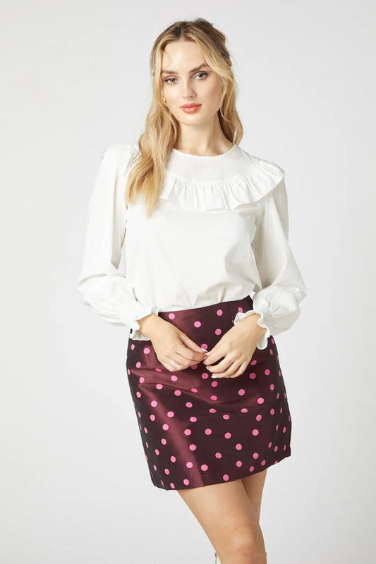 Image of a model wearing Tops. Product name - Elle Top in Cream colour by brand - Princess Highway