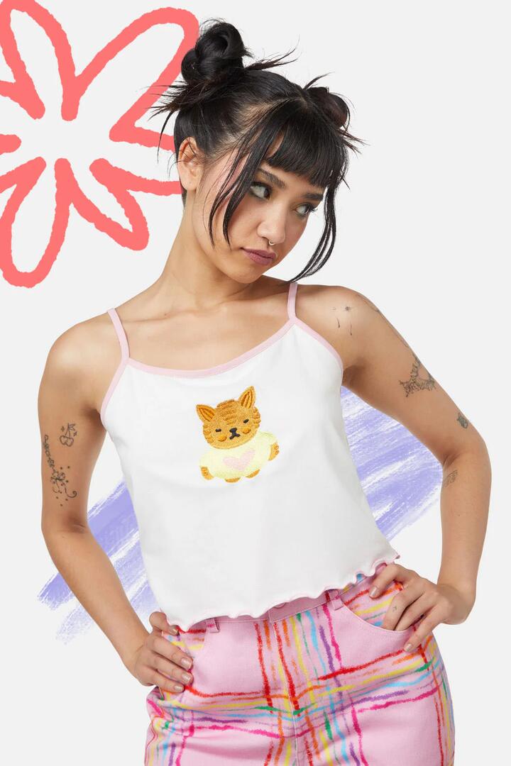 Image of a model wearing Tops. Productname: Hottest B Kewtie Singlet in White colour by brand - Dangerfield