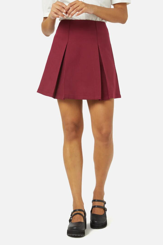 Image of a model wearing Skirts. Productname: Emma Mini Skirt in Plum colour by brand - Princess Highway