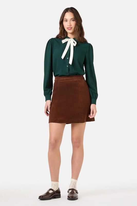 Image of a model wearing Tops. Productname: Annie Long Sleeve Bow Blouse in Green colour by brand - Princess Highway