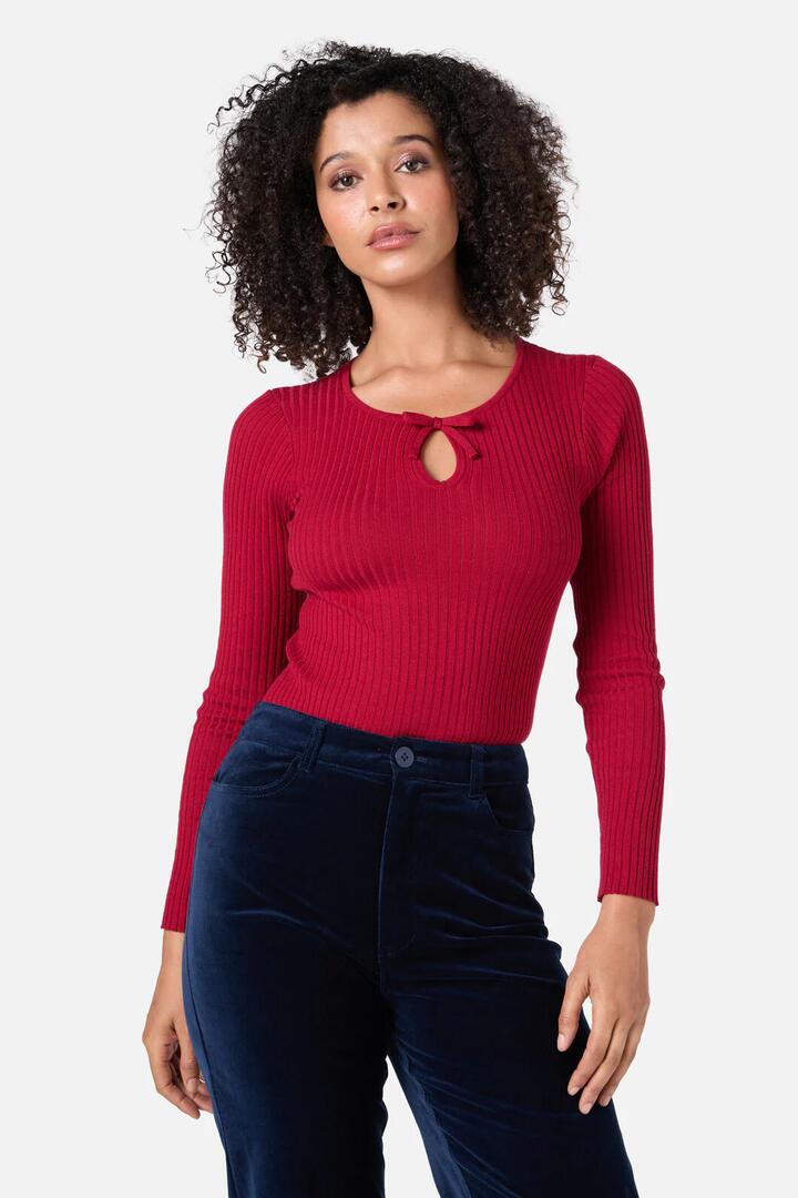 Image of a model wearing Tops. Productname: Anna Bow Knit Top in Red colour by brand - Princess Highway