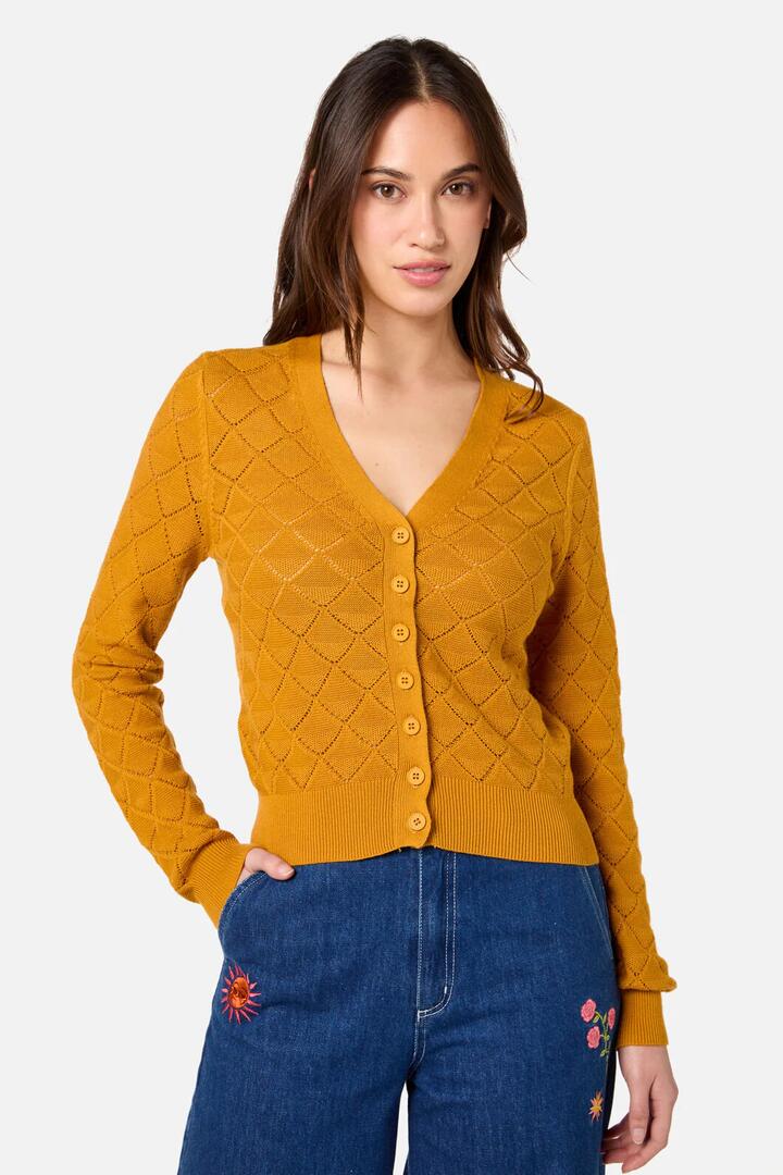 Image of a model wearing Outerwear. Productname: Celeste Cardi in Gold colour by brand - Princess Highway