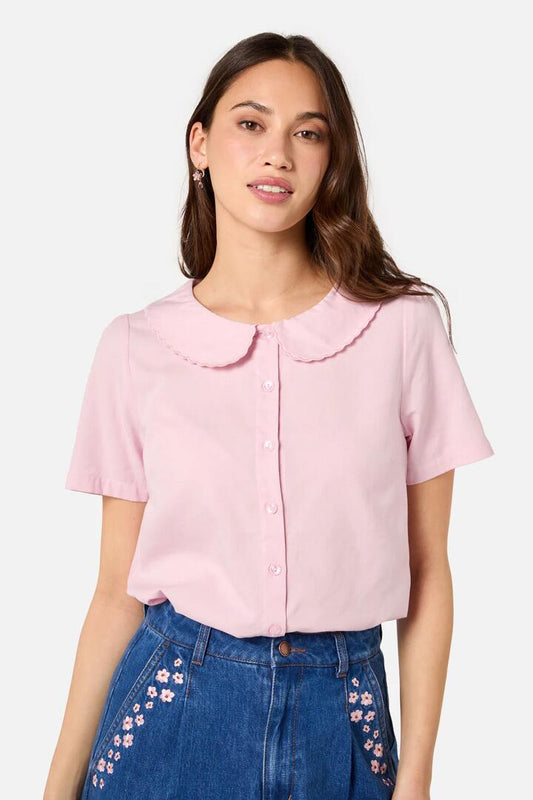 Image of a model wearing Tops. Productname: Aster Short Sleeve Blouse in Pink colour by brand - Princess Highway
