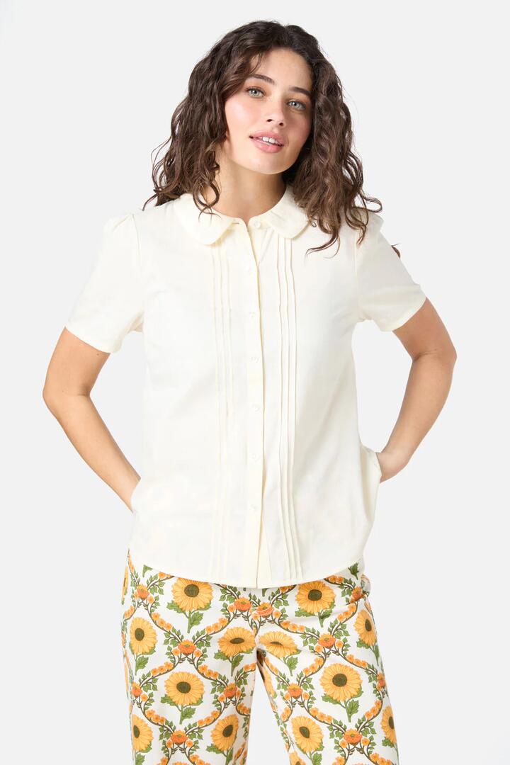 Image of a model wearing Tops. Productname: Lizzy Short Sleeve Blouse in Cream colour by brand - Princess Highway
