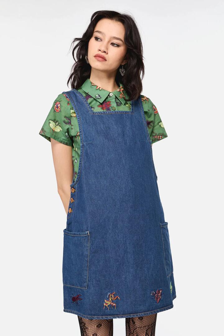 Image of a model wearing Dress. Productname: Bugs Galore Embroidered Pinafore in Blue colour by brand - Dangerfield