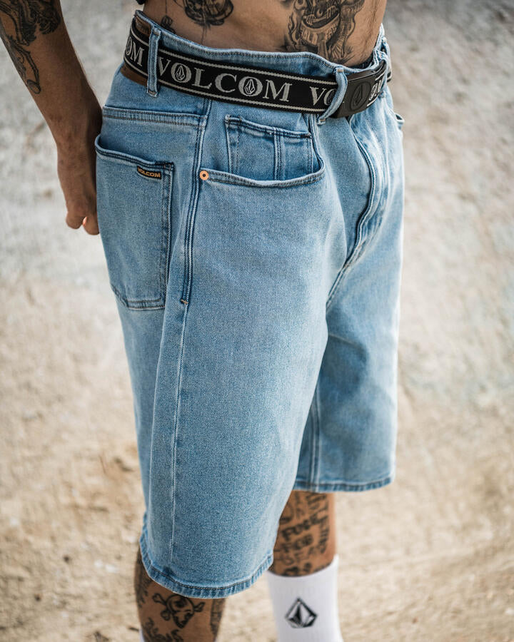 Image of a model wearing Shorts. Product name - Volcom Mens Billow 22" Denim Shorts Blueprint in Blueprint colour by brand - Volcom