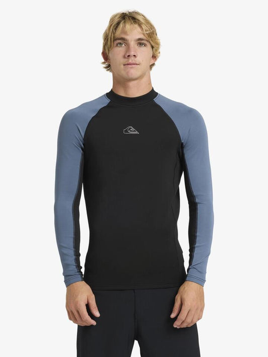 Image of a model wearing Tops. Productname: Quiksilver - Mens Everyday Heat Panel Long Sleeve Rash Vest - China Blue - in China Blue colour by brand - Quiksilver