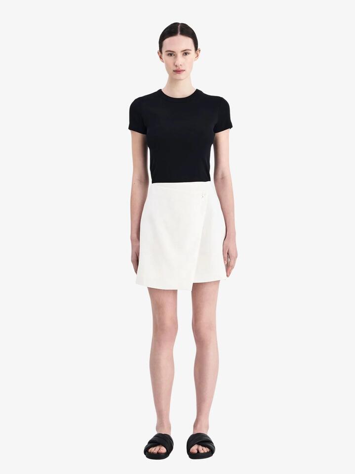 Image of a model wearing Skirts. Productname: Nude Lucy Thilda Linen Skirt in White colour by brand - Nude Lucy