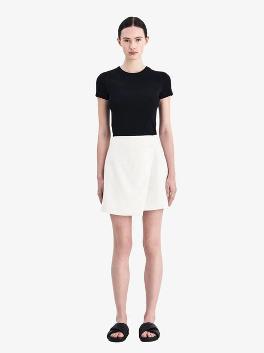 Image of a model wearing Skirts. Productname: Nude Lucy Thilda Linen Skirt in White colour by brand - Nude Lucy