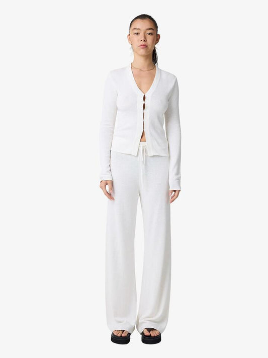 Image of a model wearing Tops. Productname: Lulu & Rose Dina Long Sleeve Knit Top in Off White colour by brand - Lulu & Rose