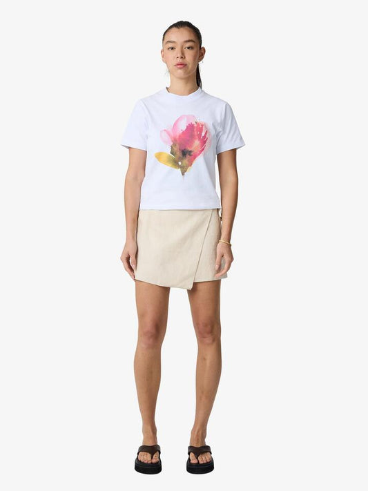 Image of a model wearing Skirts. Productname: Lulu & Rose Camille Wrap Mini Skirt in Natural colour by brand - Lulu & Rose