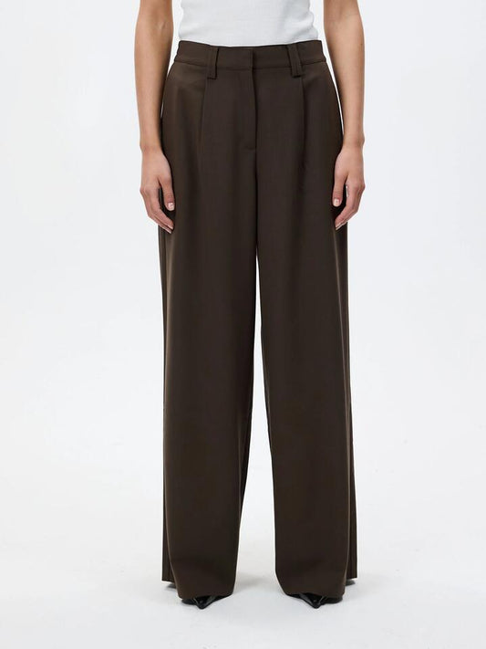 Image of a model wearing Pants. Productname: Lulu & Rose Iggy Pant in Espresso colour by brand - Lulu & Rose