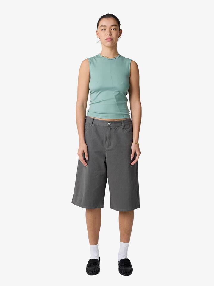 Image of a model wearing Tops. Productname: MSE Asymmetrical Tank Top in Cosmic Green colour by brand - MSE