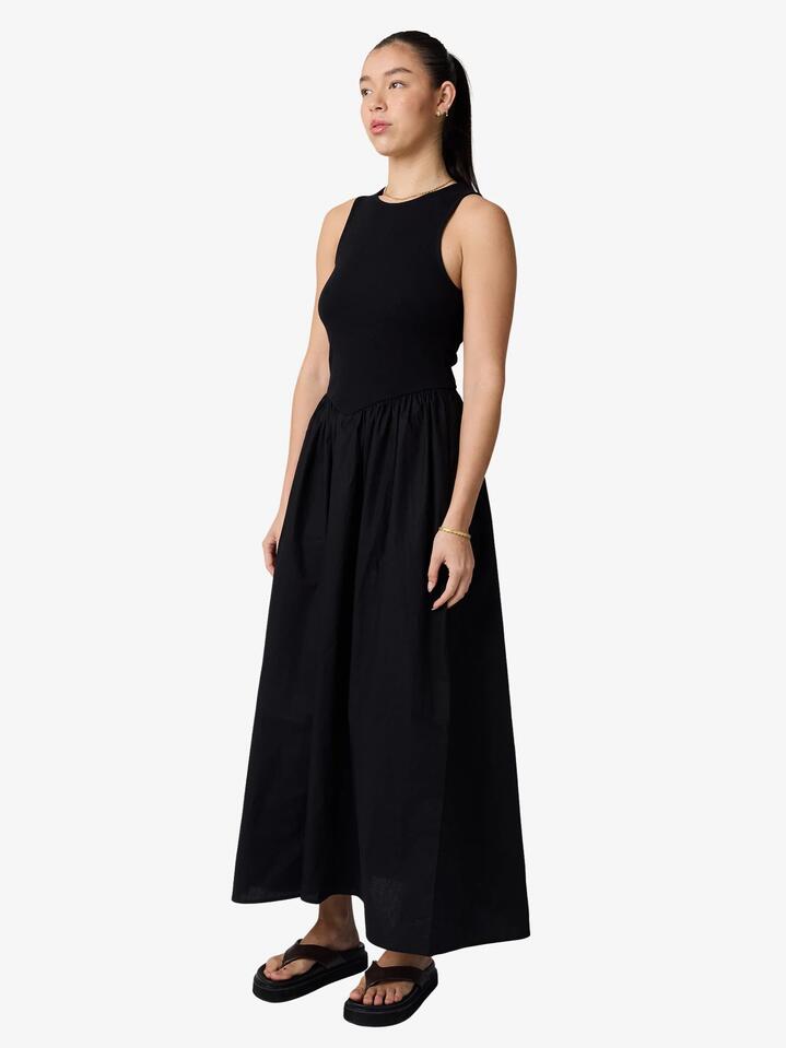 Image of a model wearing Dress. Productname: Lulu & Rose Lori Gathered Dress in Black colour by brand - Lulu & Rose