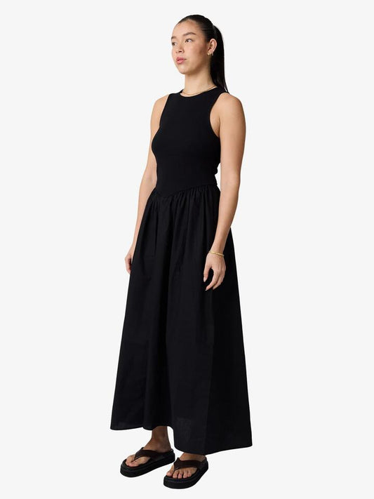 Image of a model wearing Dress. Productname: Lulu & Rose Lori Gathered Dress in Black colour by brand - Lulu & Rose
