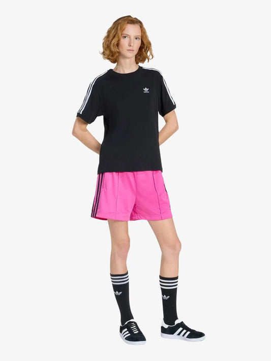 Image of a model wearing Shorts. Productname: Adidas Firebird Shorts in semi lucid fuchsia/black colour by brand - Adidas
