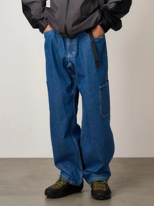 Image of a model wearing Denim. Productname: Gramicci Men's Rock Slide Denim Pant in RINSED INDIGO colour by brand - Gramicci
