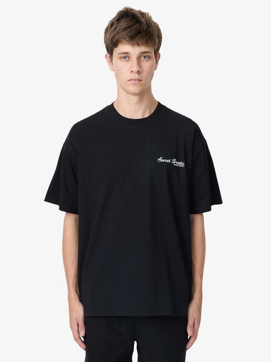 Image of a model wearing Outerwear. Productname: Weekend Cartel Sweat Treats Tee in Black colour by brand - Weekend Cartel