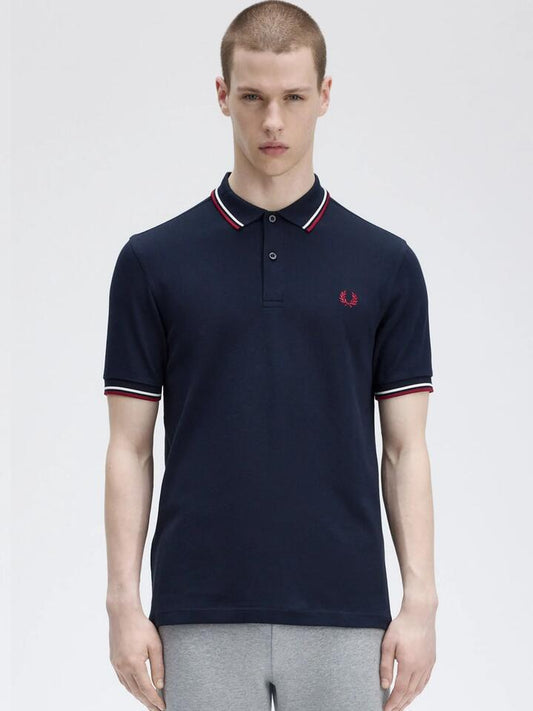 Image of a model wearing Tops. Productname: Fred Perry Twin Tipped Shirt in Navy/Snow White/Burnt Red colour by brand - Fred Perry