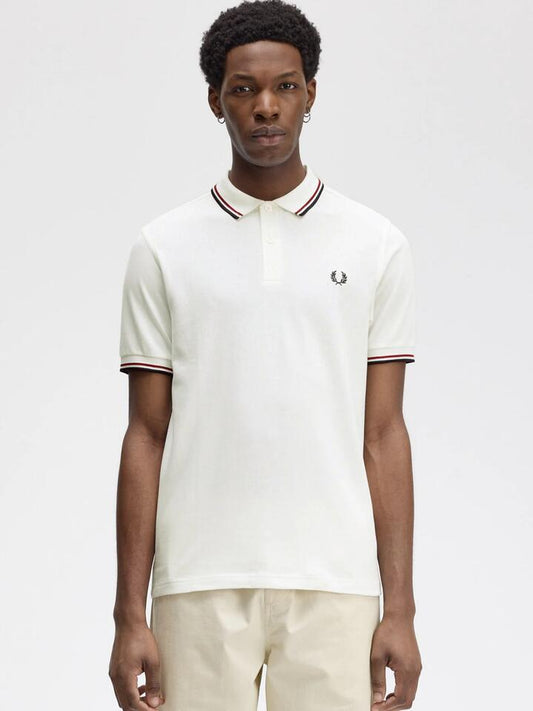 Image of a model wearing Tops. Productname: Fred Perry Twin Tipped Shirt in Snow White/Burnt Red/Navy colour by brand - Fred Perry