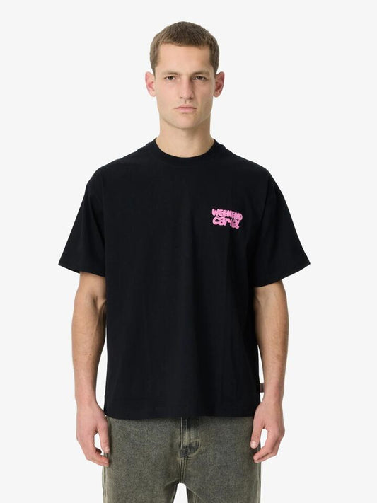 Image of a model wearing Tops. Productname: Weekend Cartel Bubble Logo Tee in Black colour by brand - Weekend Cartel